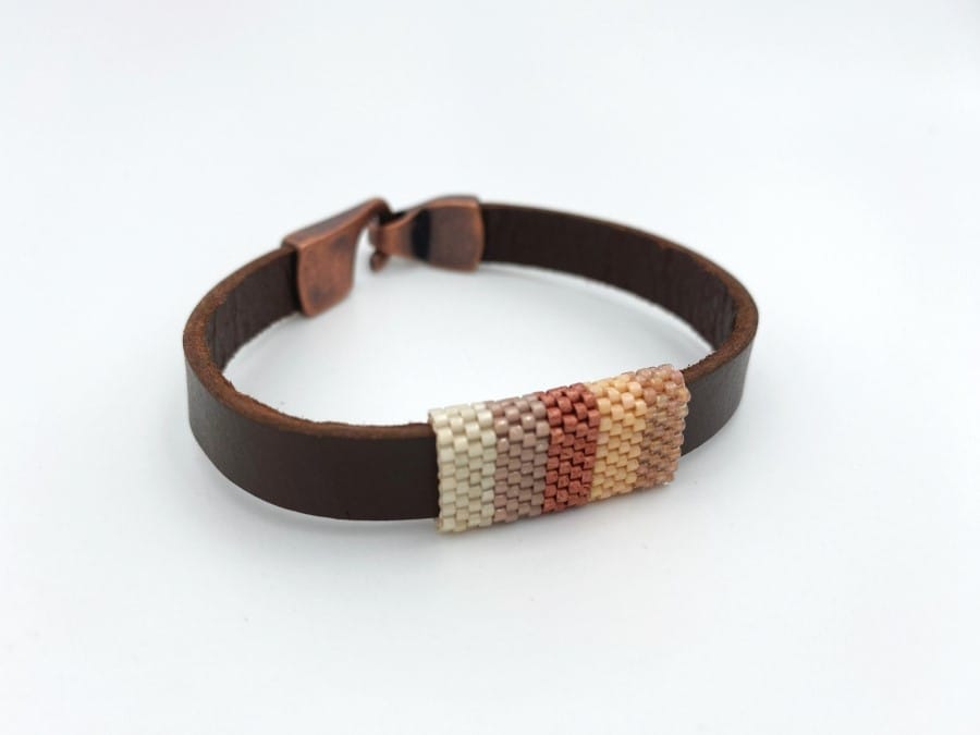 Handmade leather unisex bracelet with beaded inlay crafted in hues of beige and brown