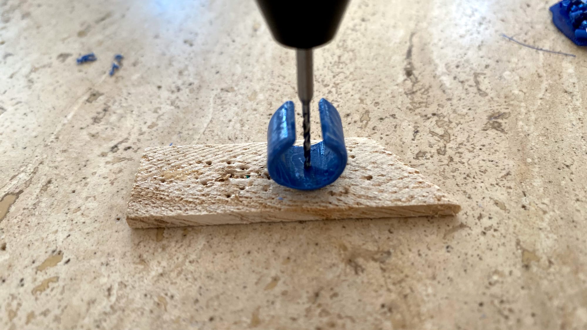 Making a hole in the center of the clay element.